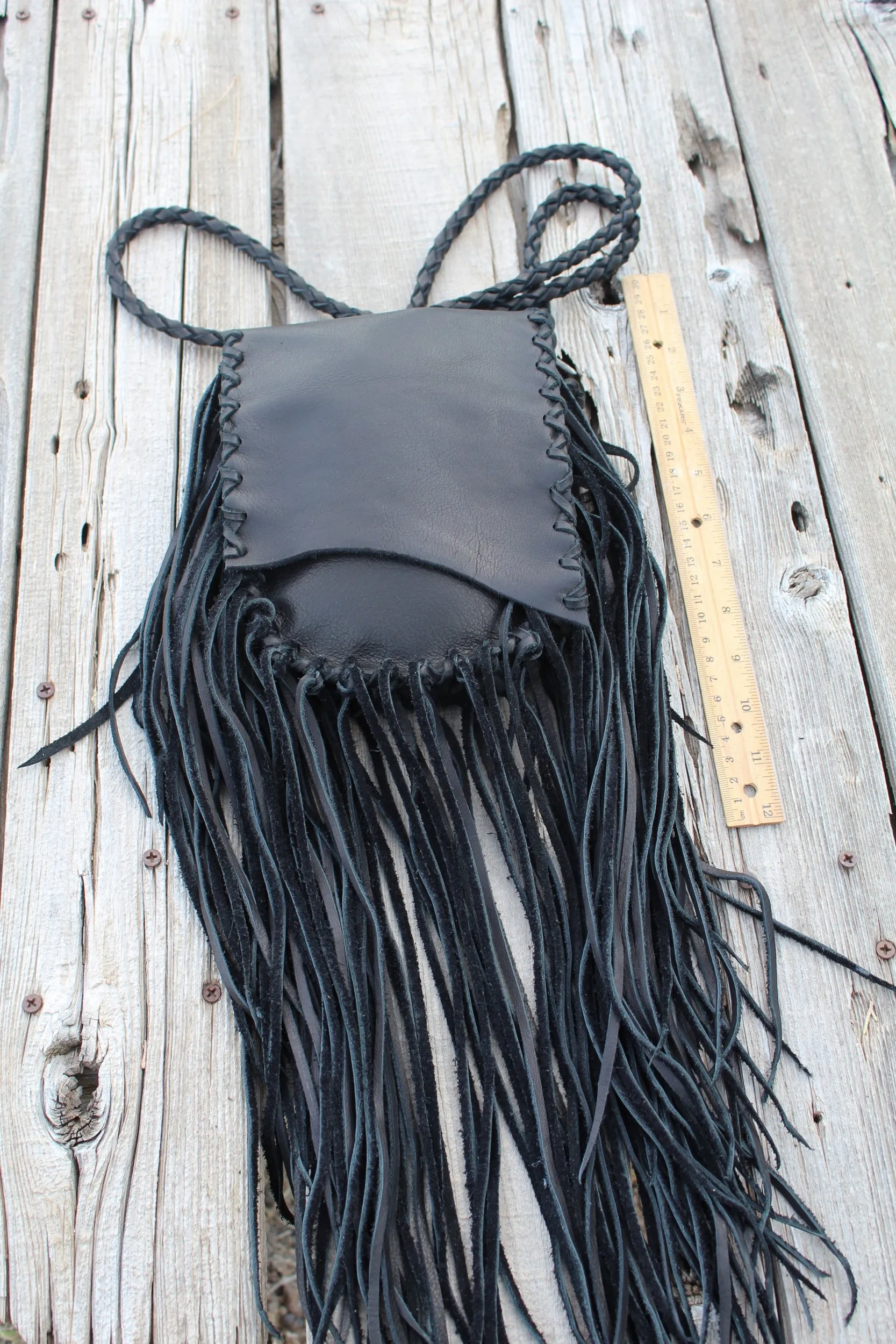 Black leather handbag with fringe, crossbody bag